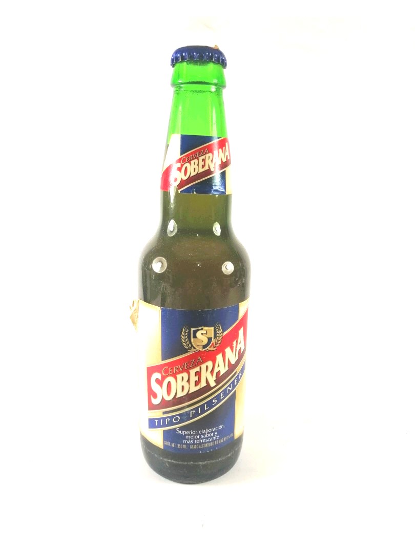 BOTELLA DE CERVEZA RETRO. SOBERANA, 1RA EDICION. 1990s (REP. DOMINICANA)